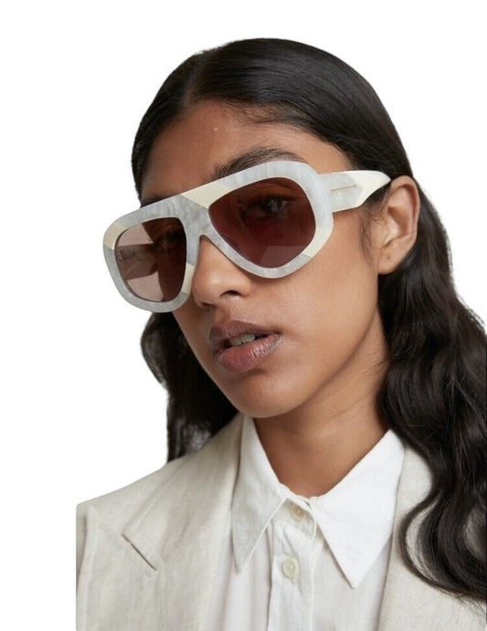 Naked Pear Karen Walker Centurion aviator sunglasses in marble stripe acetate with brown lenses worn by a model