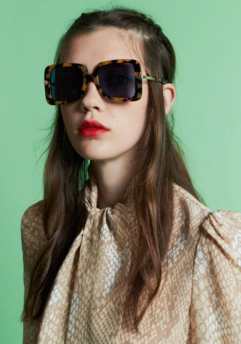 Naked Pear Karen Walker Eden oversized D-frame sunglasses in crazy tortoise shell acetate with blue mono-tinted lenses.
