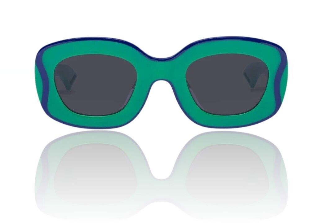 Naked Pear Karen Walker Field Trip sunglasses in grasshopper green acetate with wavy blue lamination and smoke lenses