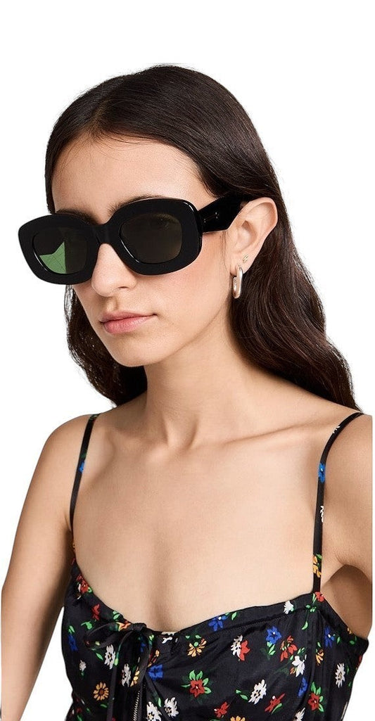 Naked Pear Karen Walker Field Trip sunglasses featuring a chunky black bio-acetate rectangular frame and green lenses.