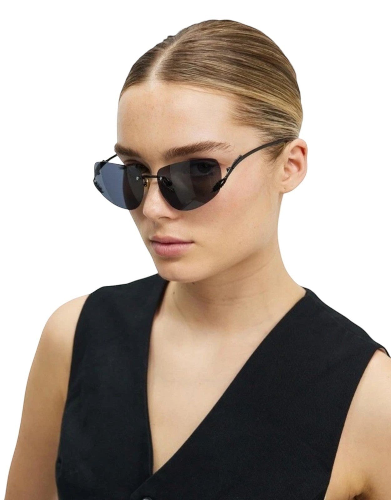 Naked Pear model wearing Karen Walker Fleur rimless sunglasses with black Monel frames and grey mono lenses.