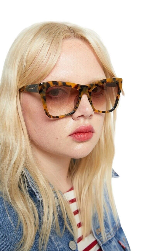 Naked Pear model wearing Karen Walker Hallowed oversized cat-eye sunglasses in crazy tortoise shell bio-acetate.