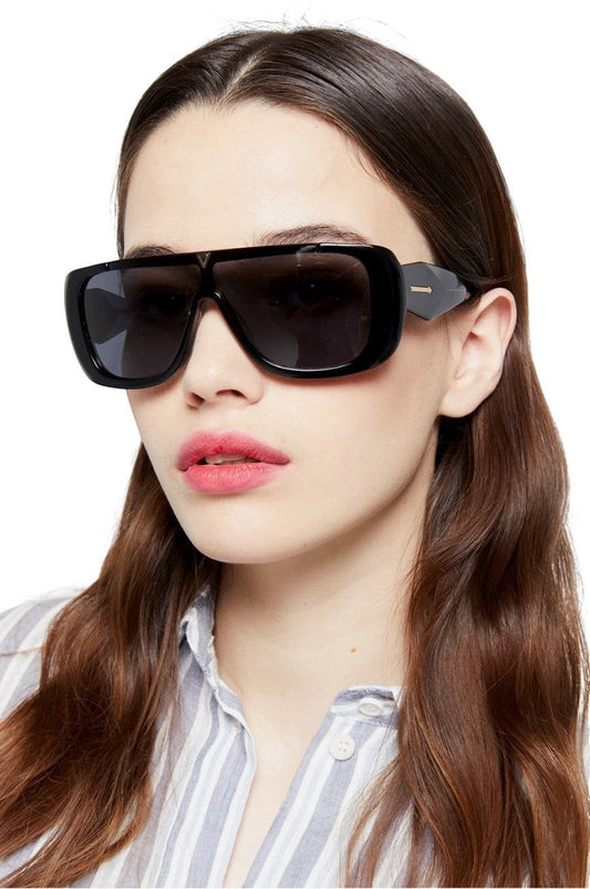 Naked Pear Karen Walker Hexed B black bio-acetate shield sunglasses with smoke mono lenses worn by a model