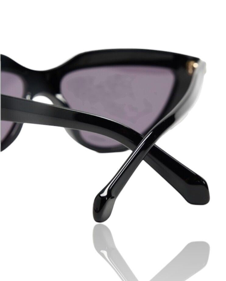 Naked Pear Karen Walker Lash Splash black cat-eye sunglasses with grey mono lenses and signature temple hardware.