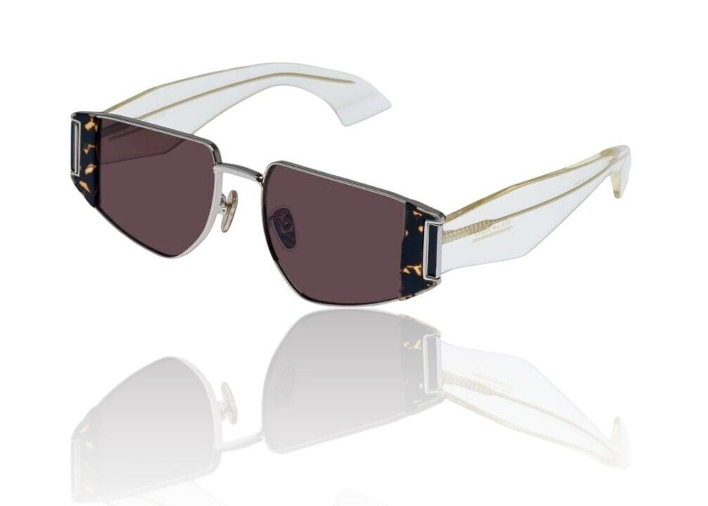 Naked Pear Karen Walker Nix sunglasses featuring a silver metal frame, clear acetate temples, and brown mono lenses.