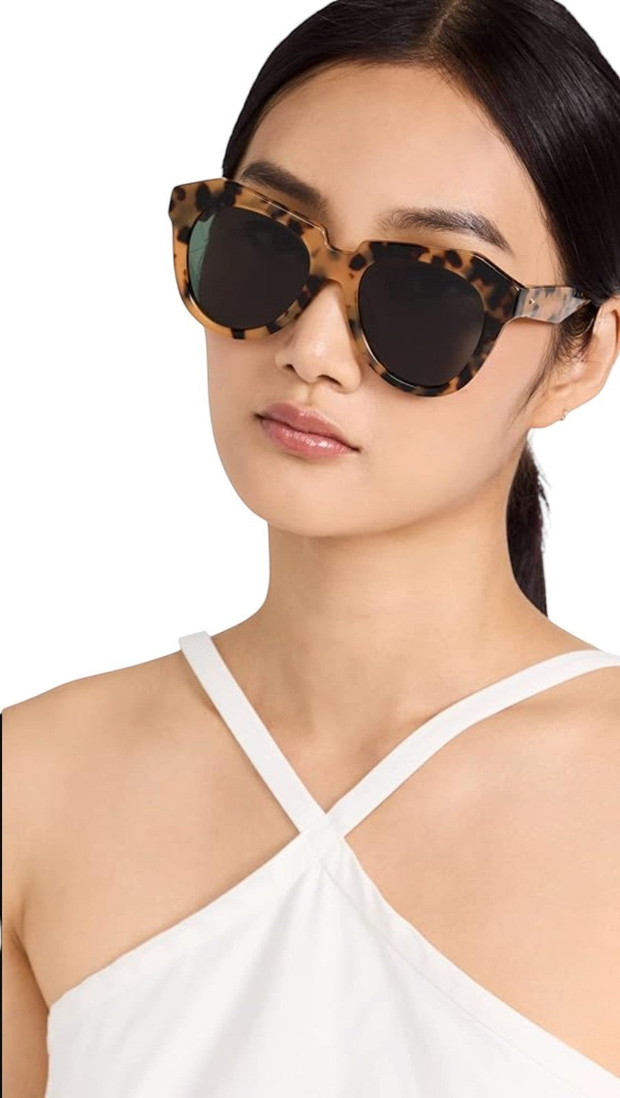 Model wearing Naked Pear Karen Walker Number One 22 B cat-eye sunglasses in tortoise shell bio-acetate with grey lenses