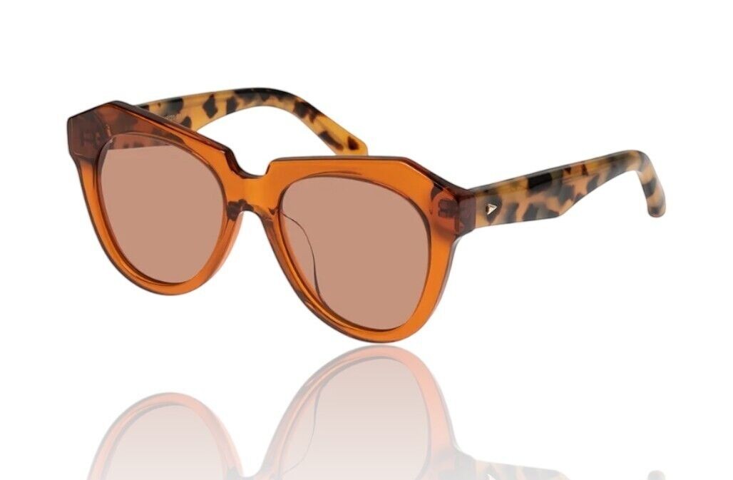 Naked Pear Karen Walker Number One oversized cat-eye sunglasses in persimmon acetate with tortoise shell arms.