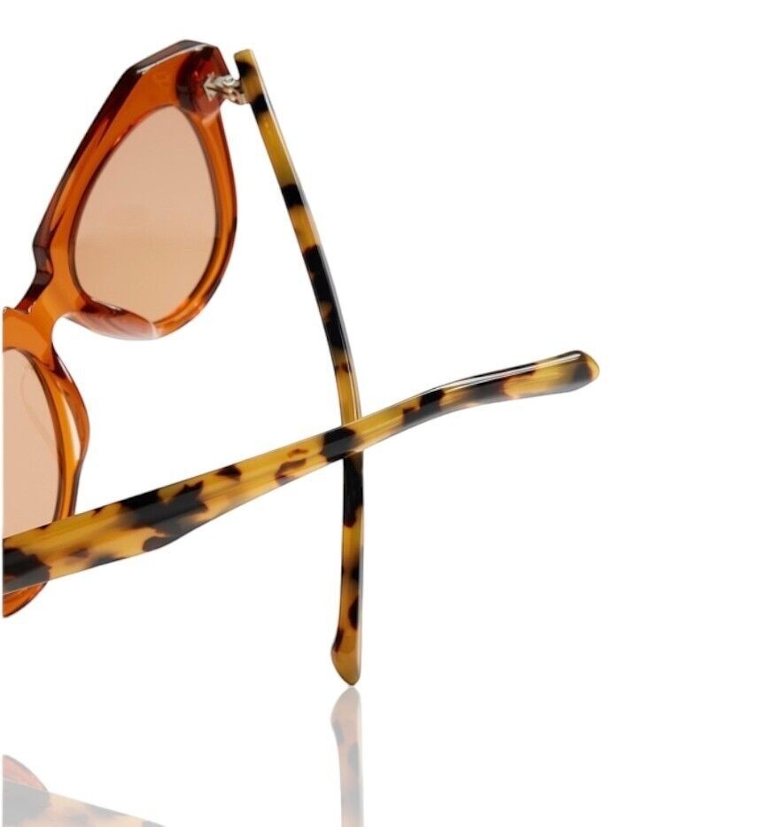 Naked Pear Karen Walker Number One sunglasses featuring persimmon acetate frames and tortoise shell arms
