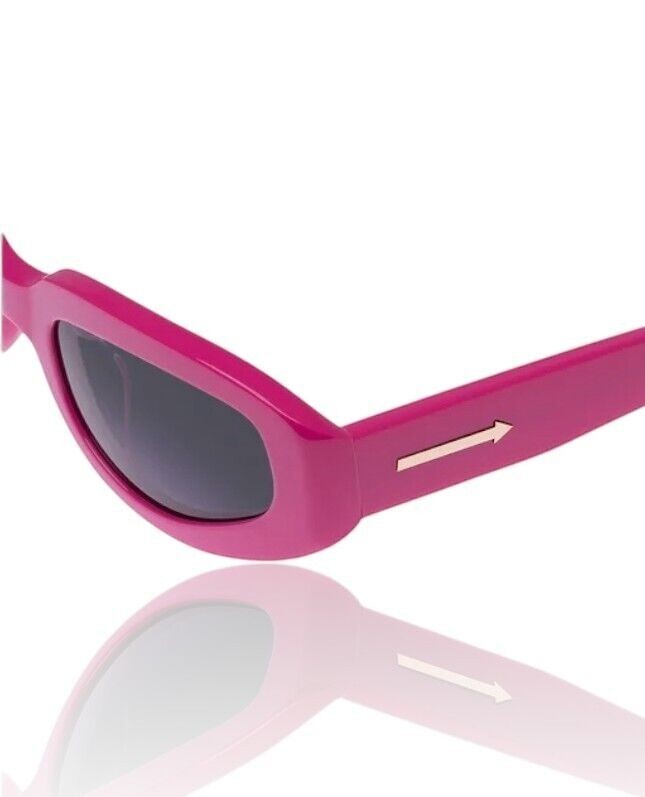 Naked Pear Karen Walker Rally sunglasses in glossy fuchsia pink acetate with smoke grey lenses and gold arrow detail.