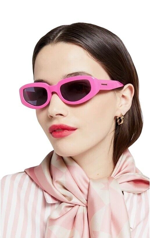 Naked Pear Karen Walker Rally sunglasses in bright fuchsia pink acetate with smoke grey lenses and gold arrow detail.