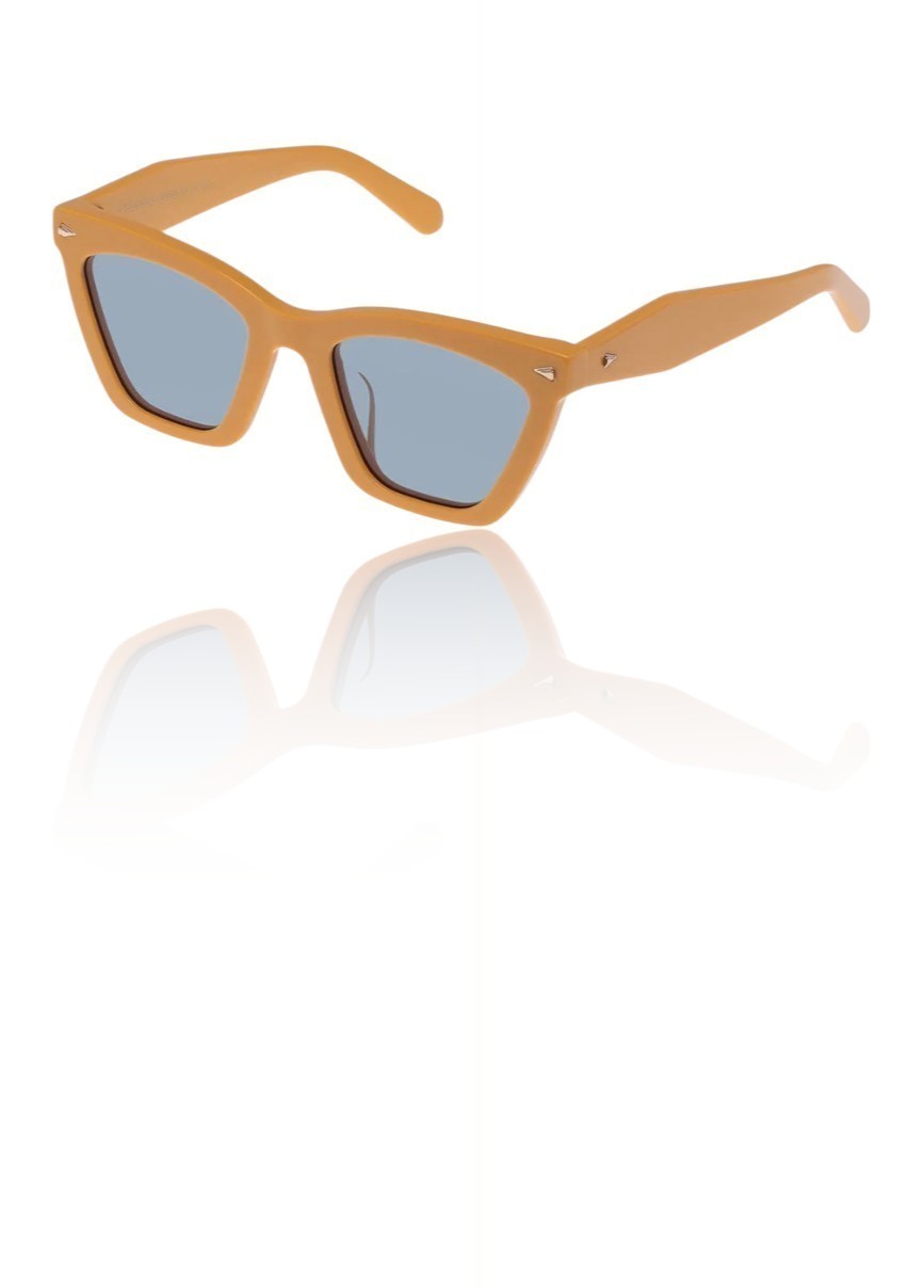 Naked Pear Karen Walker Spellbound cat-eye sunglasses in marigold acetate with emerald-tinted lenses and gold hardware.