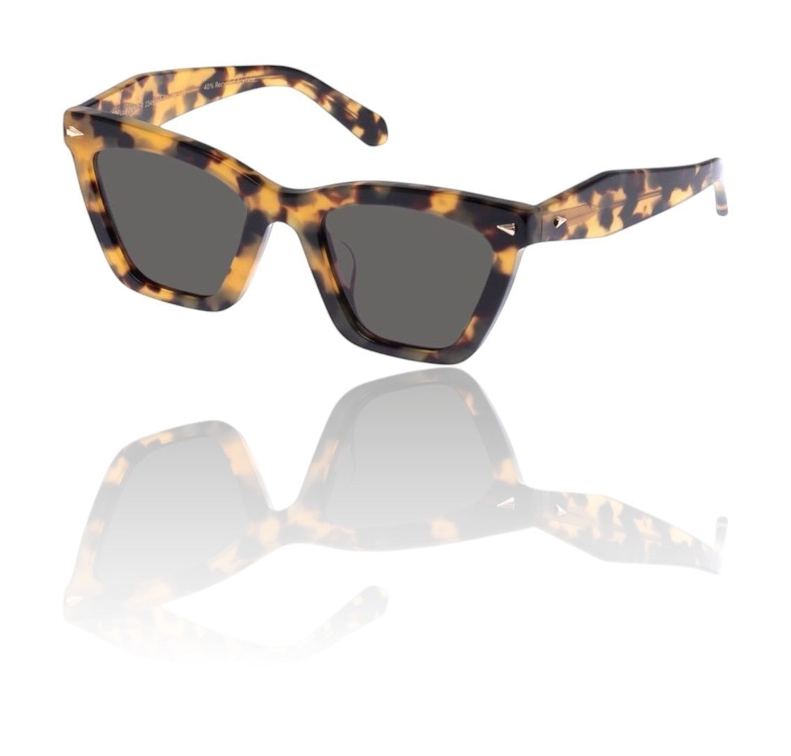 Naked Pear Karen Walker Spellbound cat-eye sunglasses in crazy tortoise shell acetate with smoke lenses and gold arrows.