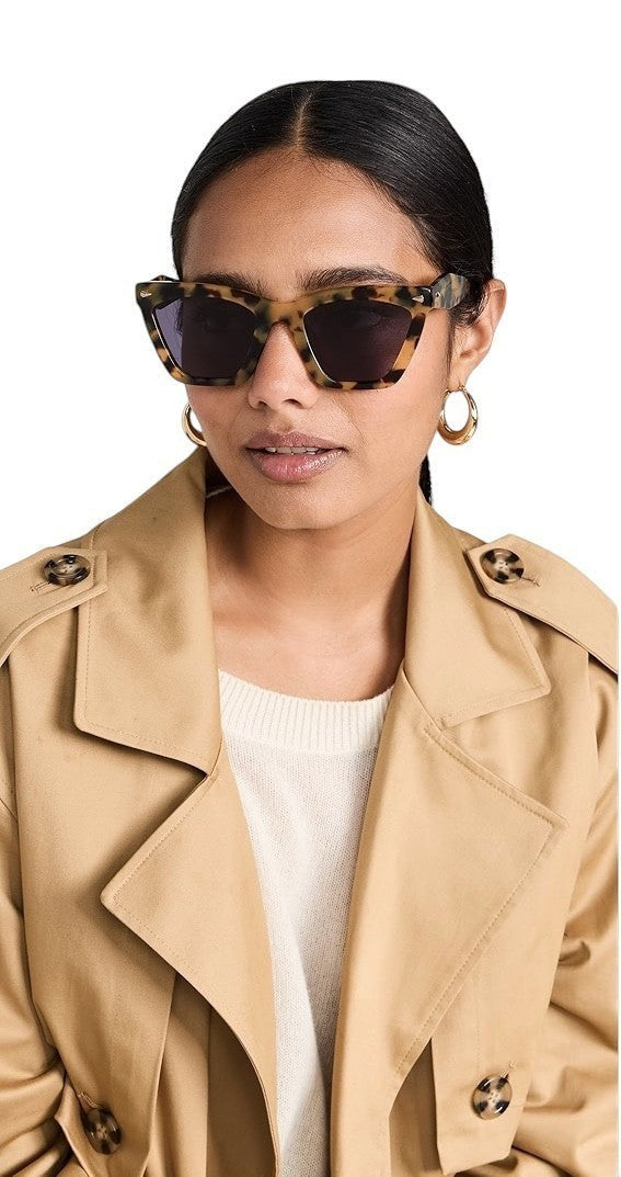 Naked Pear Karen Walker Spellbound cat-eye sunglasses in crazy tortoise shell acetate with smoke lenses on a model.