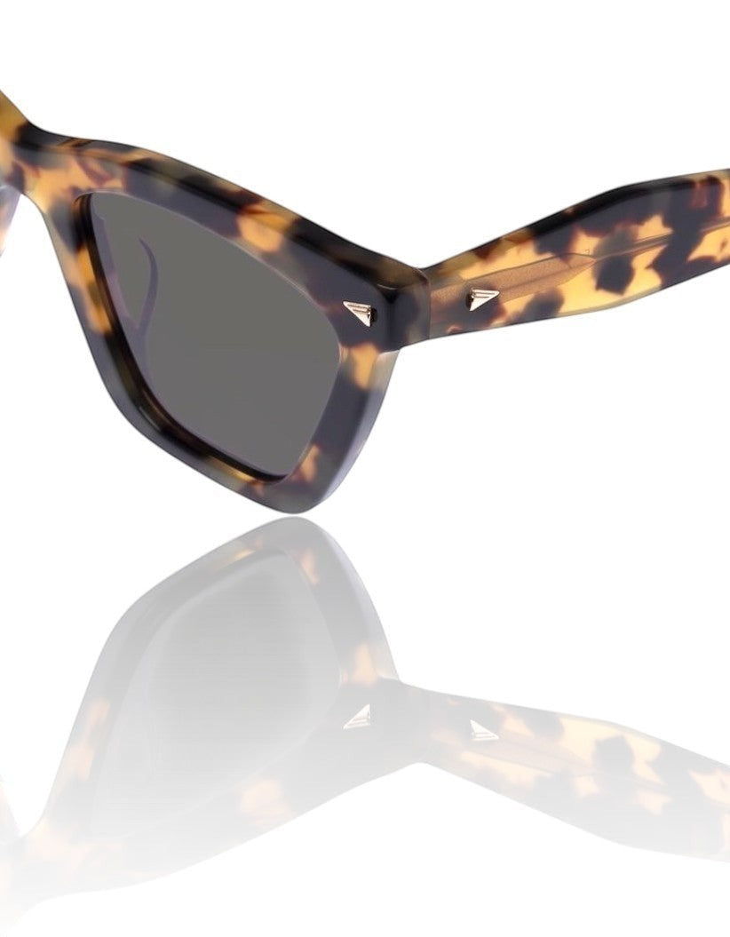 Naked Pear Karen Walker Spellbound cat-eye sunglasses in crazy tortoise shell acetate with gold arrow hardware.