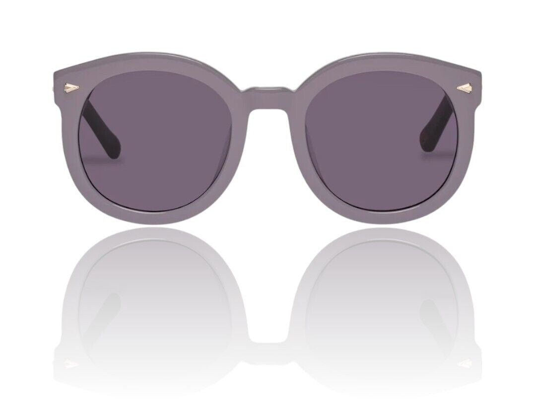 Naked Pear Karen Walker Super Duper Strength sunglasses in lilac plum bio-acetate with round frames and arrowhead pins.