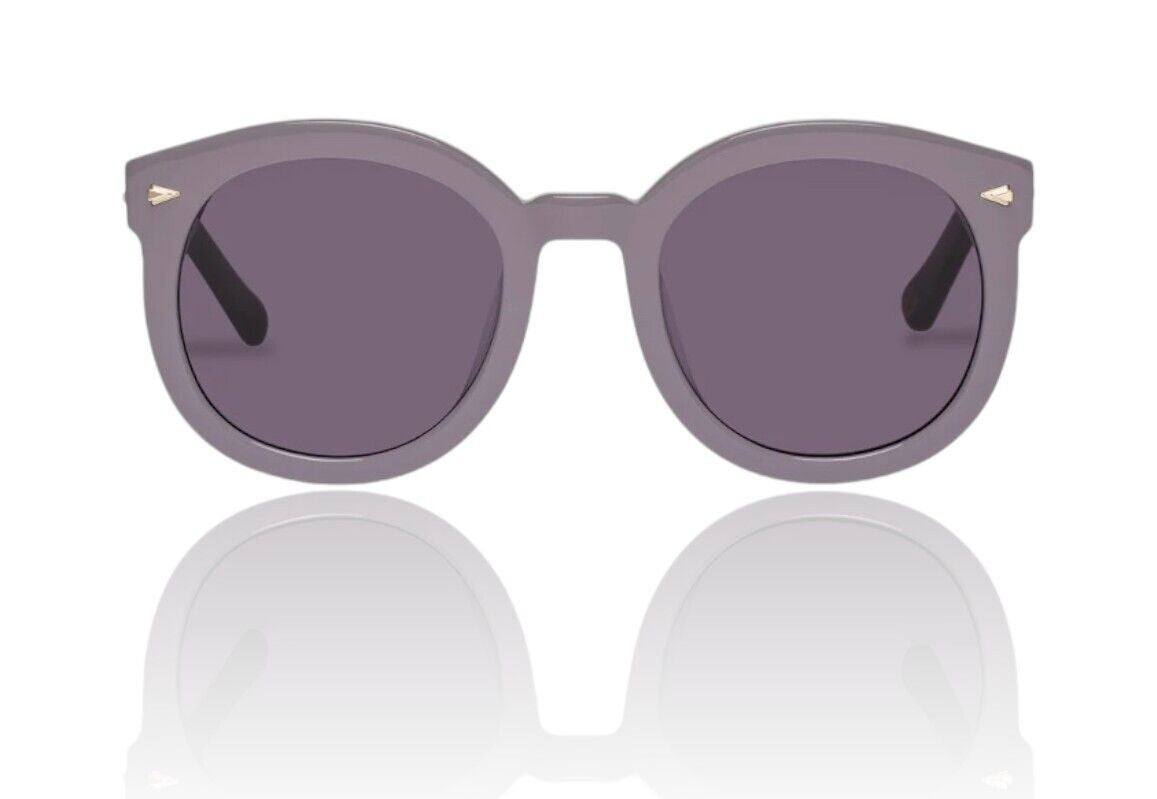 Naked Pear Karen Walker Super Duper Strength sunglasses in lilac plum bio-acetate with round frames and arrowhead pins.