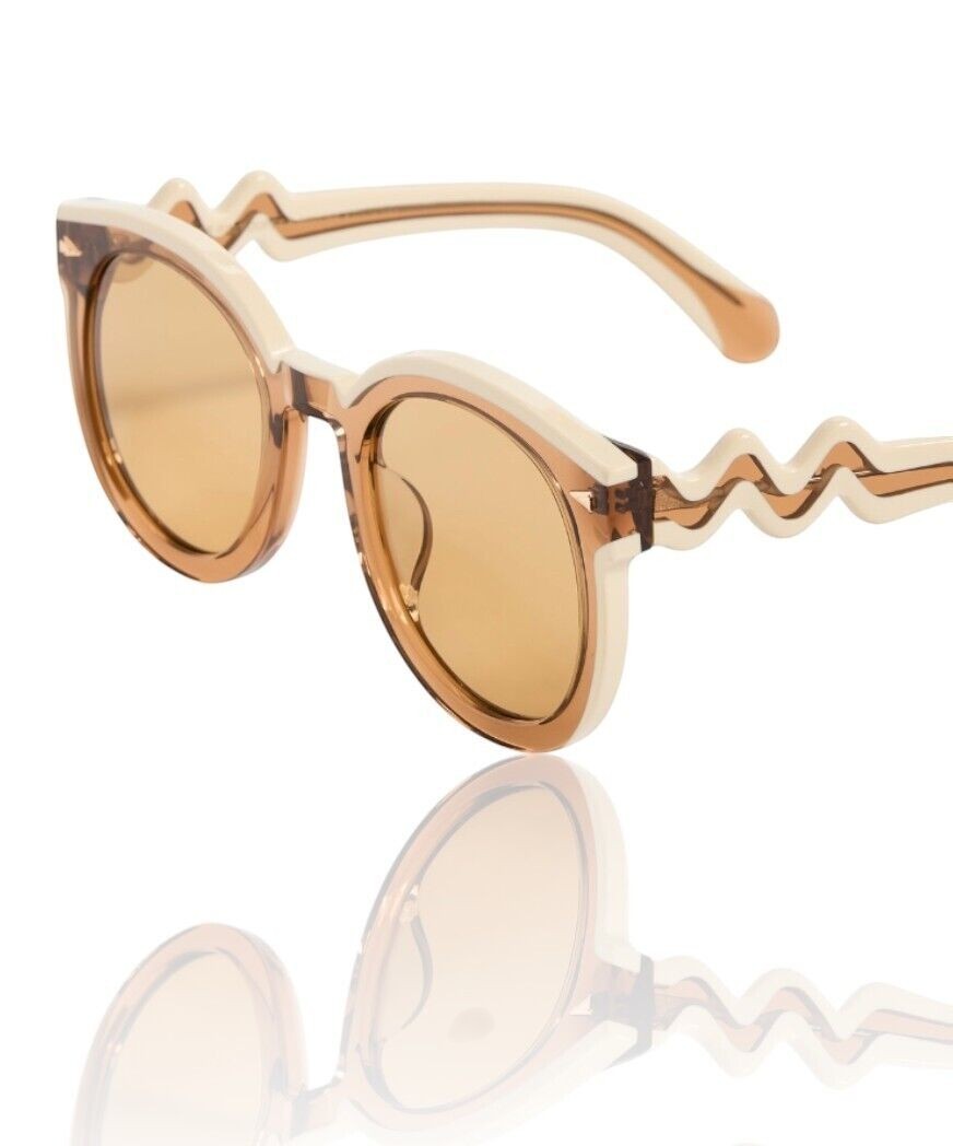 Naked Pear Karen Walker Super Wavy Duper sunglasses in ochre tan and white with round frames and wavy arms.