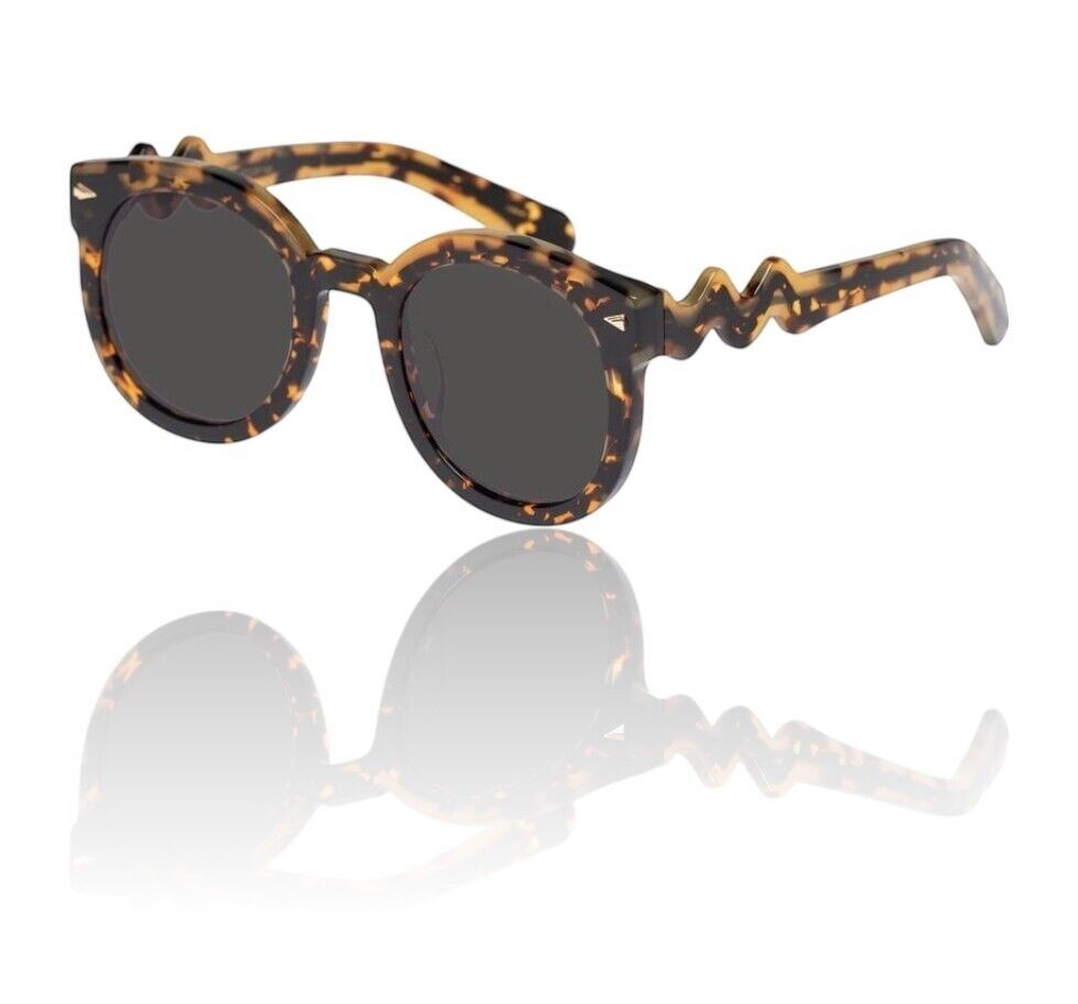 Naked Pear Karen Walker Super Wavy Duper sunglasses featuring round tortoise shell frames and unique wavy arms.