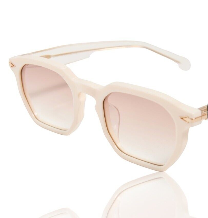 Naked Pear Karen Walker Trillion sunglasses with ivory geometric acetate frames and brown gradient lenses.