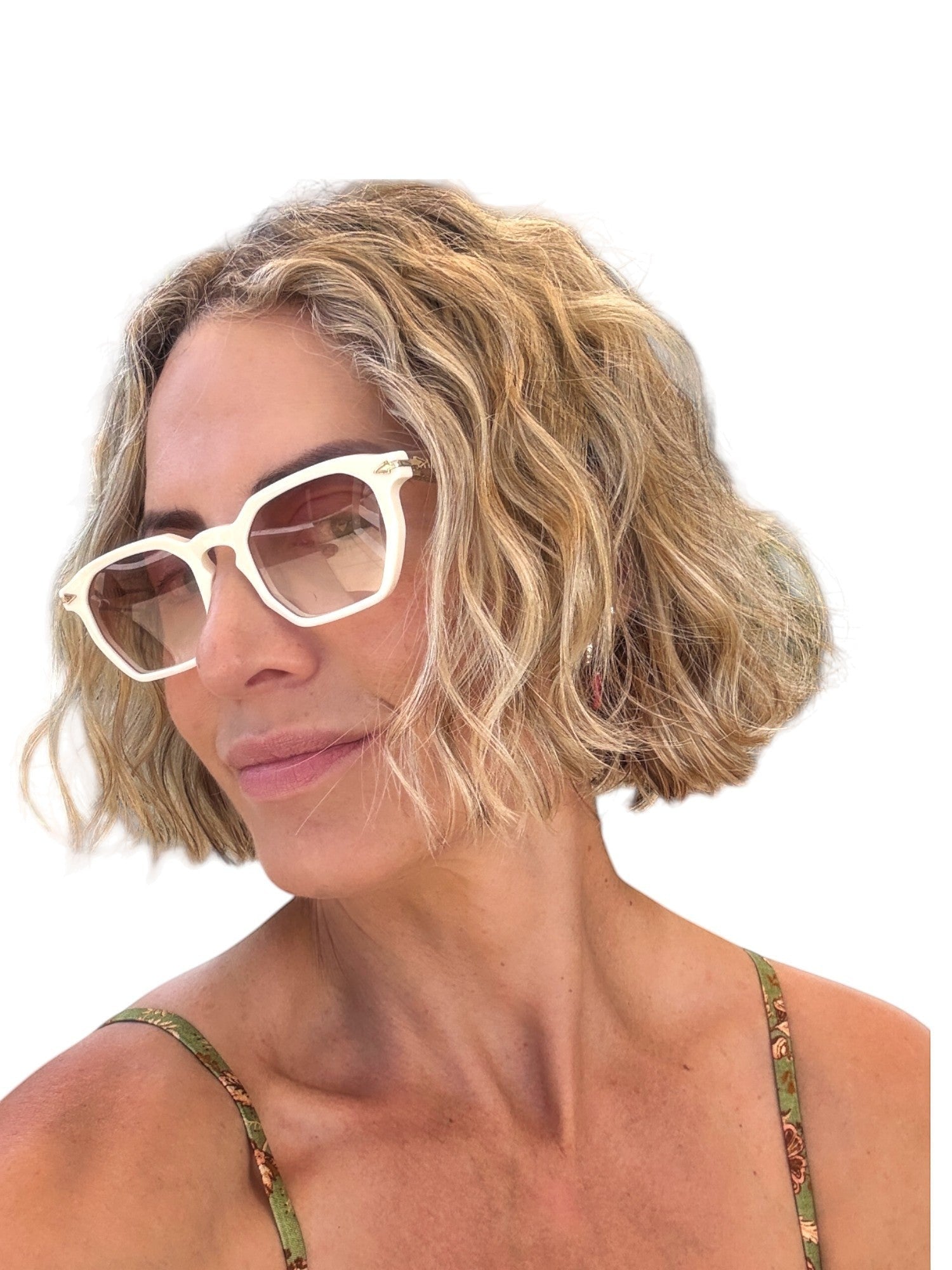 Woman wearing Naked Pear Karen Walker Trillion geometric ivory acetate sunglasses with brown gradient lenses