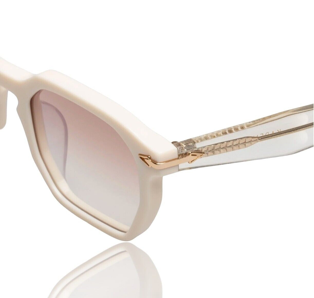 Naked Pear Karen Walker Trillion sunglasses featuring ivory geometric acetate frames, tan gradient lenses, and gold arrows