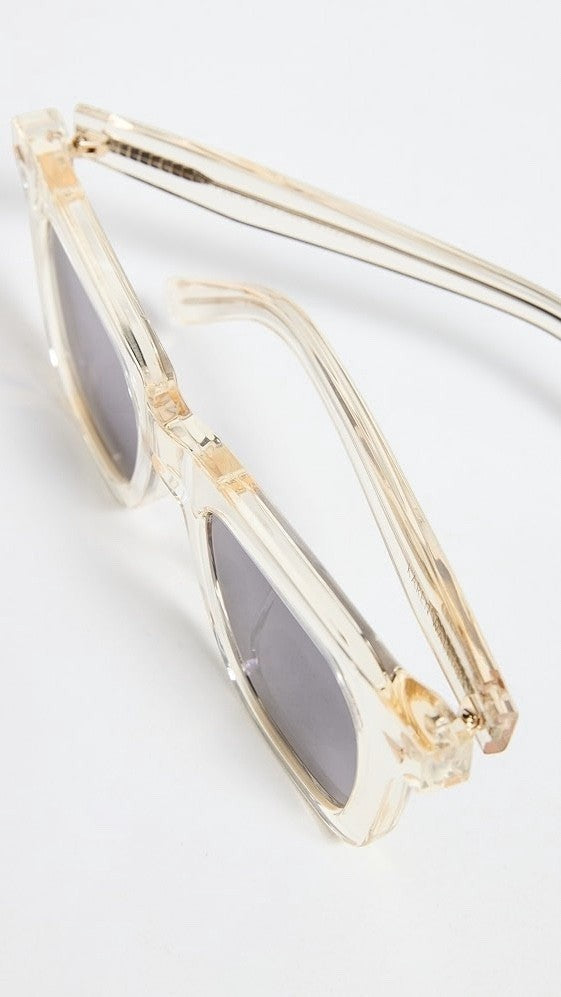 Naked Pear Karen Walker Triple Ripple square sunglasses in vintage clear acetate with grey lenses and gold hardware.