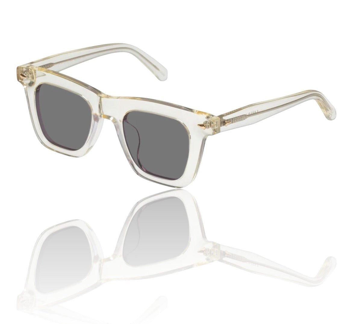 Naked Pear Karen Walker Triple Ripple square sunglasses in vintage clear acetate with grey lenses and gold hardware.
