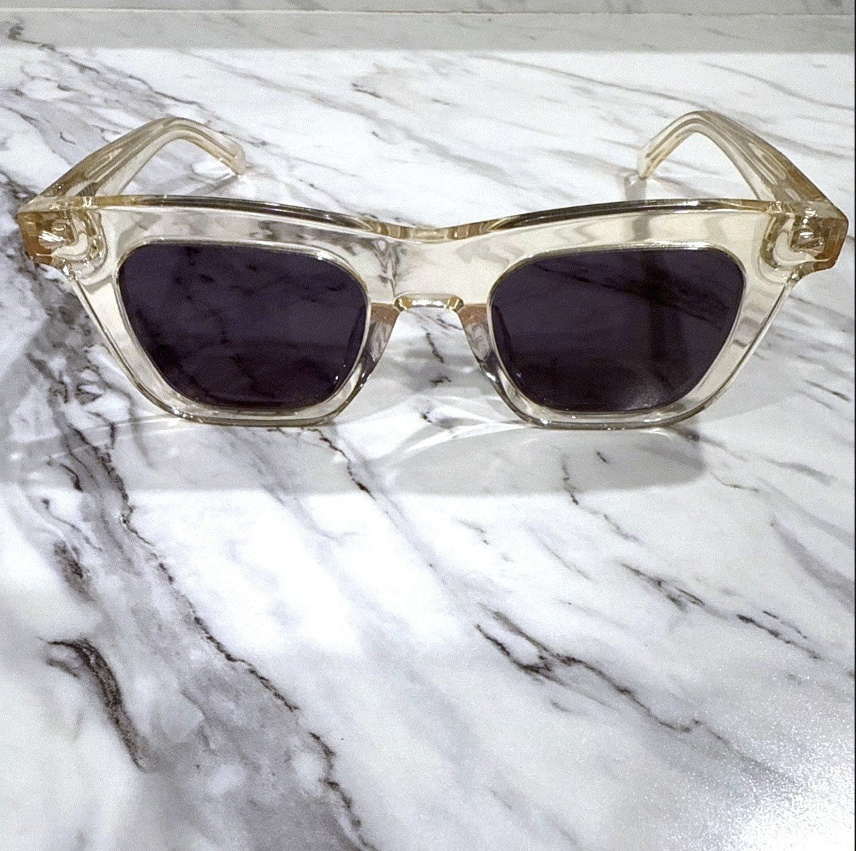 Naked Pear Karen Walker Triple Ripple square sunglasses with vintage clear acetate frames and grey mono lenses.