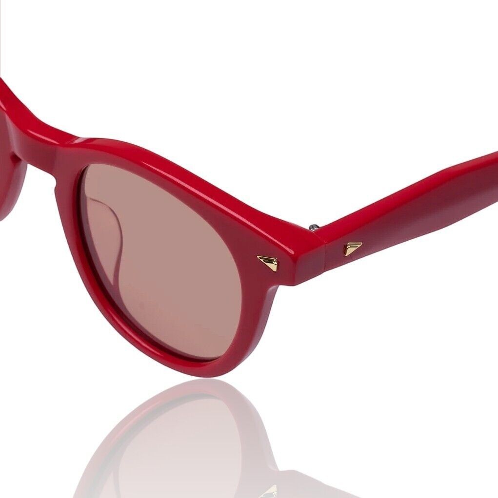 Naked Pear Karen Walker Wilderness round scarlet red acetate sunglasses with persimmon tint lenses and arrow hardware.