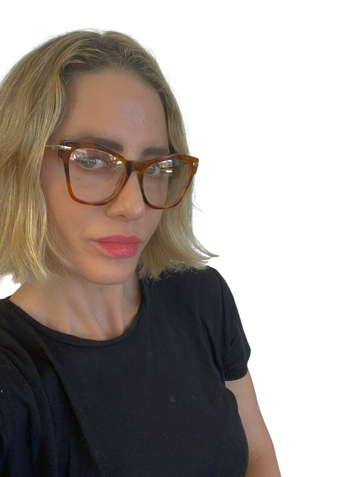 Naked Pear model wearing oversized tortoiseshell cat eye Karen Walker Wilma optical glasses with gold arrow hinges