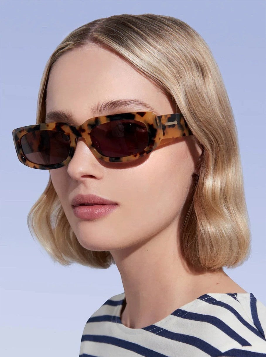 Naked Pear Karen Walker Zahra B rectangle sunglasses in crazy tortoise shell with brown lenses on a blonde model