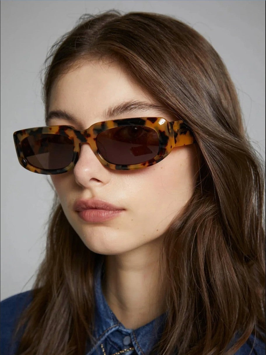 Naked Pear Karen Walker Zahra B rectangle sunglasses in crazy tortoise shell with brown lenses on a model