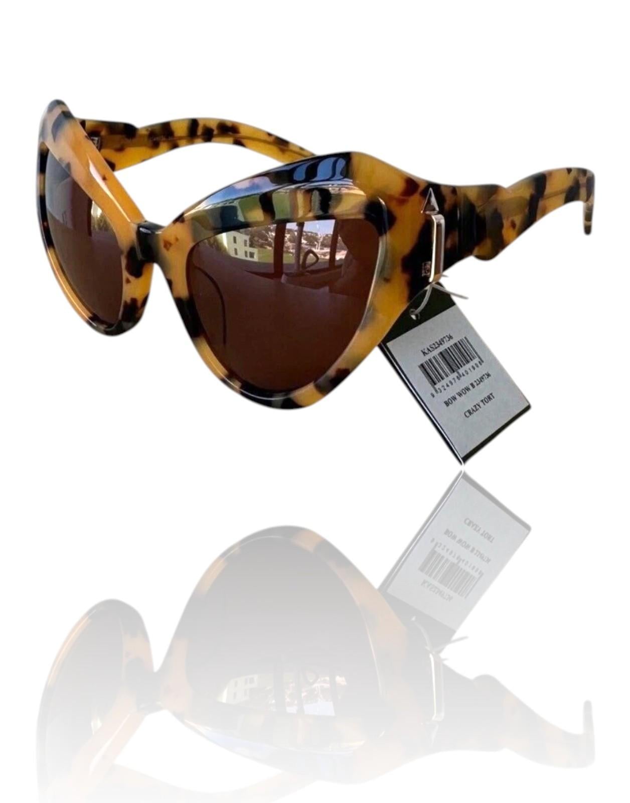 Sunglasses with tortoiseshell frame and brown lenses on a white background