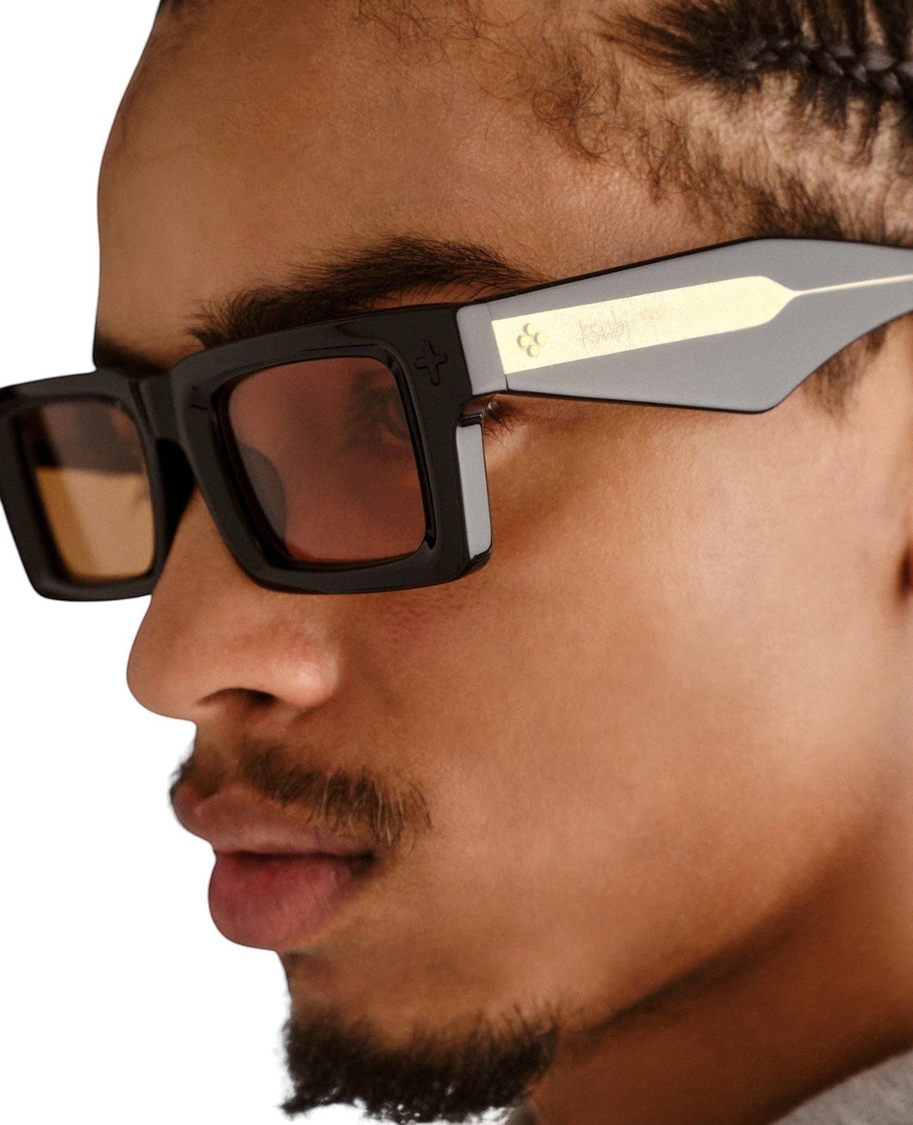 Naked Pear Ksubi Goodsen II unisex D-frame sunglasses in glossy black acetate with amber lenses and gold temple detail.