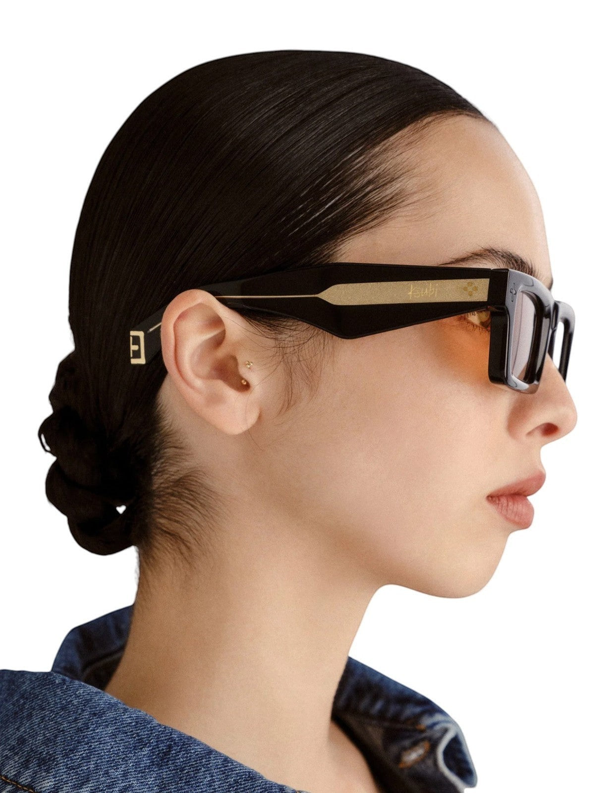 Naked Pear Ksubi Goodsen II sunglasses featuring glossy black acetate D-frame, amber lenses, and gold temple details.