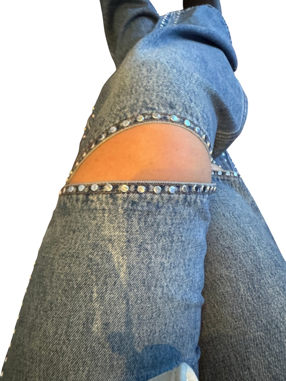 Naked Pear Ksubi blue denim jeans featuring silver studded knee cut outs and a relaxed straight leg fit