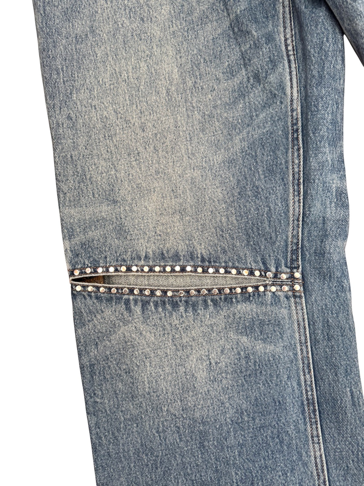 Naked Pear Ksubi Low Rider jeans in indigo denim featuring a knee cutout with silver hot-fix studding detail.