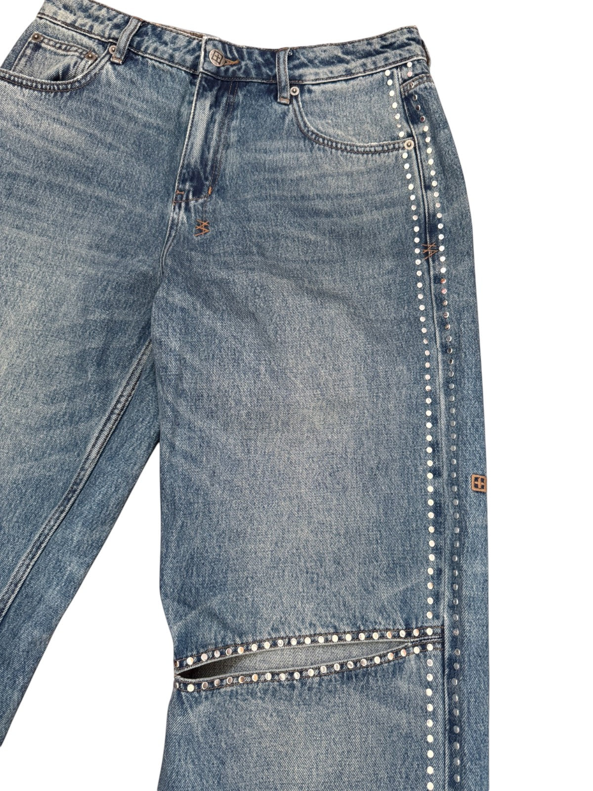Naked Pear Ksubi Low Rider jeans in indigo denim with silver stud detailing and a horizontal knee cutout.