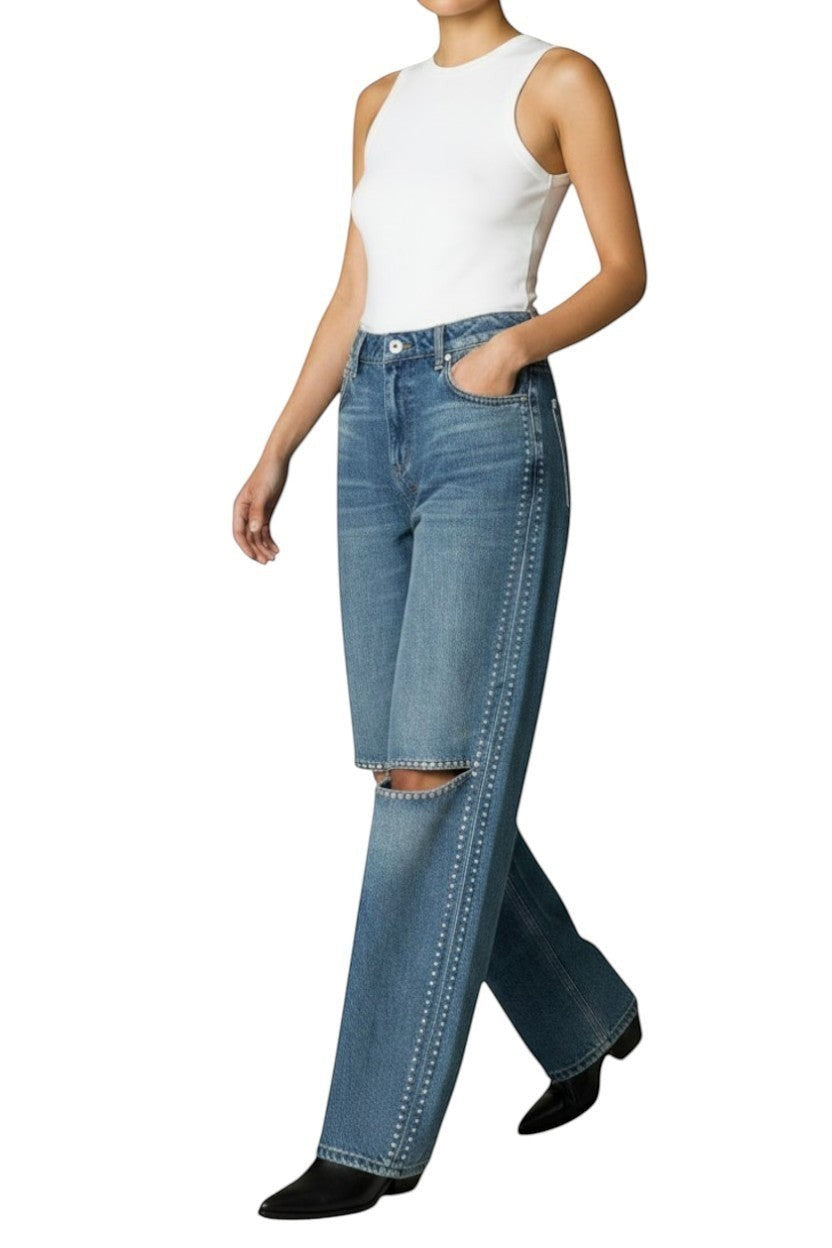 Naked Pear Ksubi Low Rider indigo denim jeans featuring silver studs, knee cutouts, and a relaxed straight-leg fit.