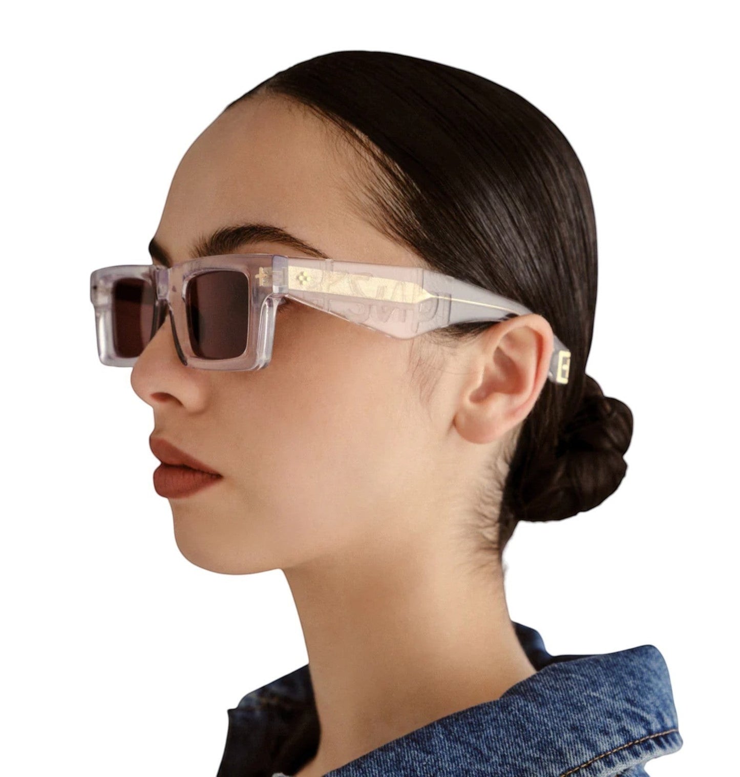 Model wearing Naked Pear Ksubi Smiths II rectangle sunglasses with krystal gold acetate frames and brown lenses.