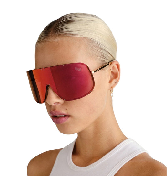 Naked Pear Ksubi Tyrell shield sunglasses with gold frame and oversized red mirror lenses worn by a model