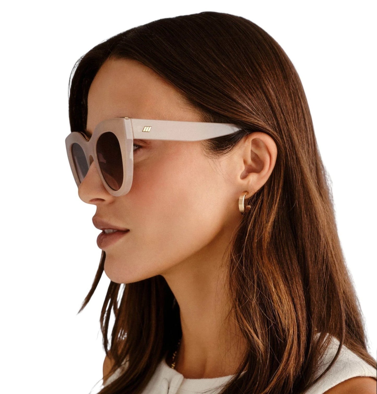 Naked Pear Le Specs Air Heart cat eye sunglasses in oatmeal acetate with khaki gradient lenses worn by a woman