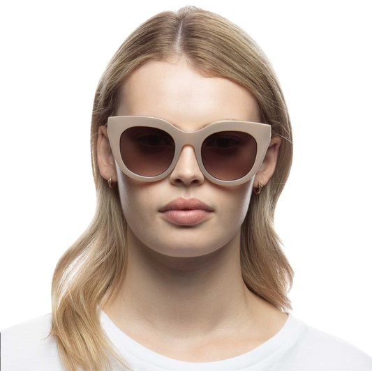 Naked Pear Le Specs Air Heart cat eye sunglasses in oatmeal acetate with khaki gradient lenses on a model