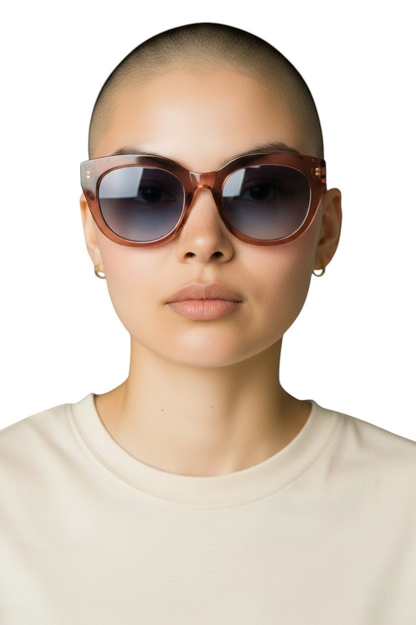 Naked Pear Le Specs Air Heart cat eye sunglasses in smokey pink with grey gradient lenses on a model