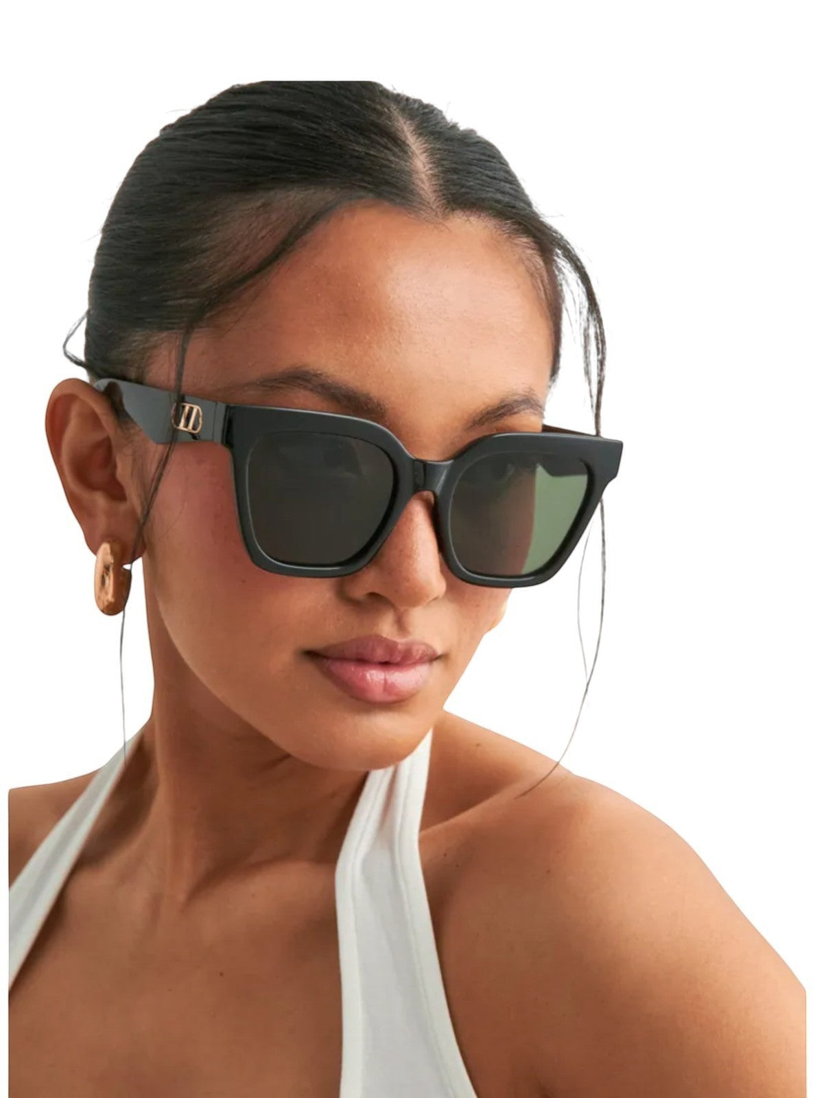 Naked Pear Le Specs Star Glow black oversized cat-eye sunglasses with gold chain link hardware on a woman