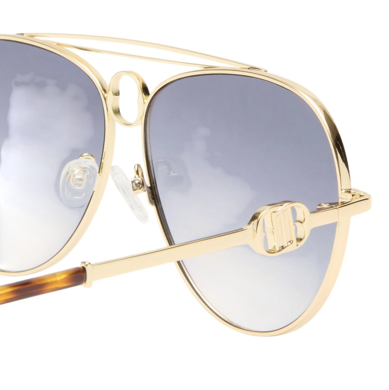 Gold-framed sunglasses with gray lenses on a white background