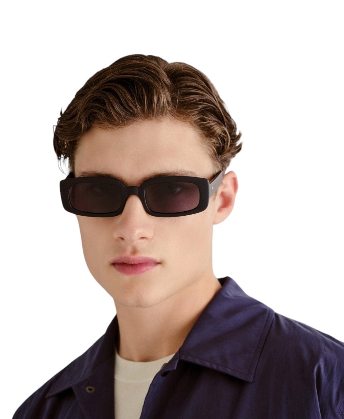 Person wearing dark sunglasses on a white background