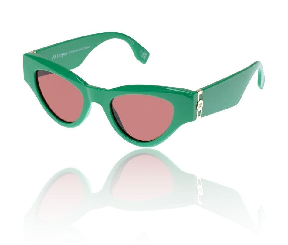 Green sunglasses with pink lenses on a white background