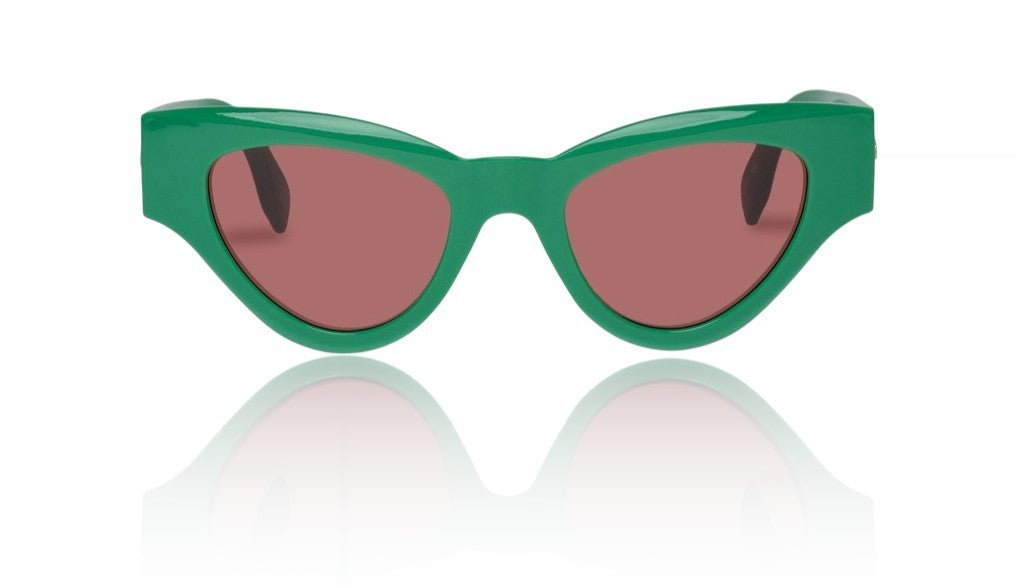Green sunglasses with red lenses on a white background