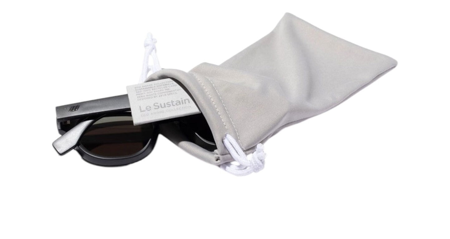 Sunglasses in a gray dust bag with 'Le Spec' branding on a white background